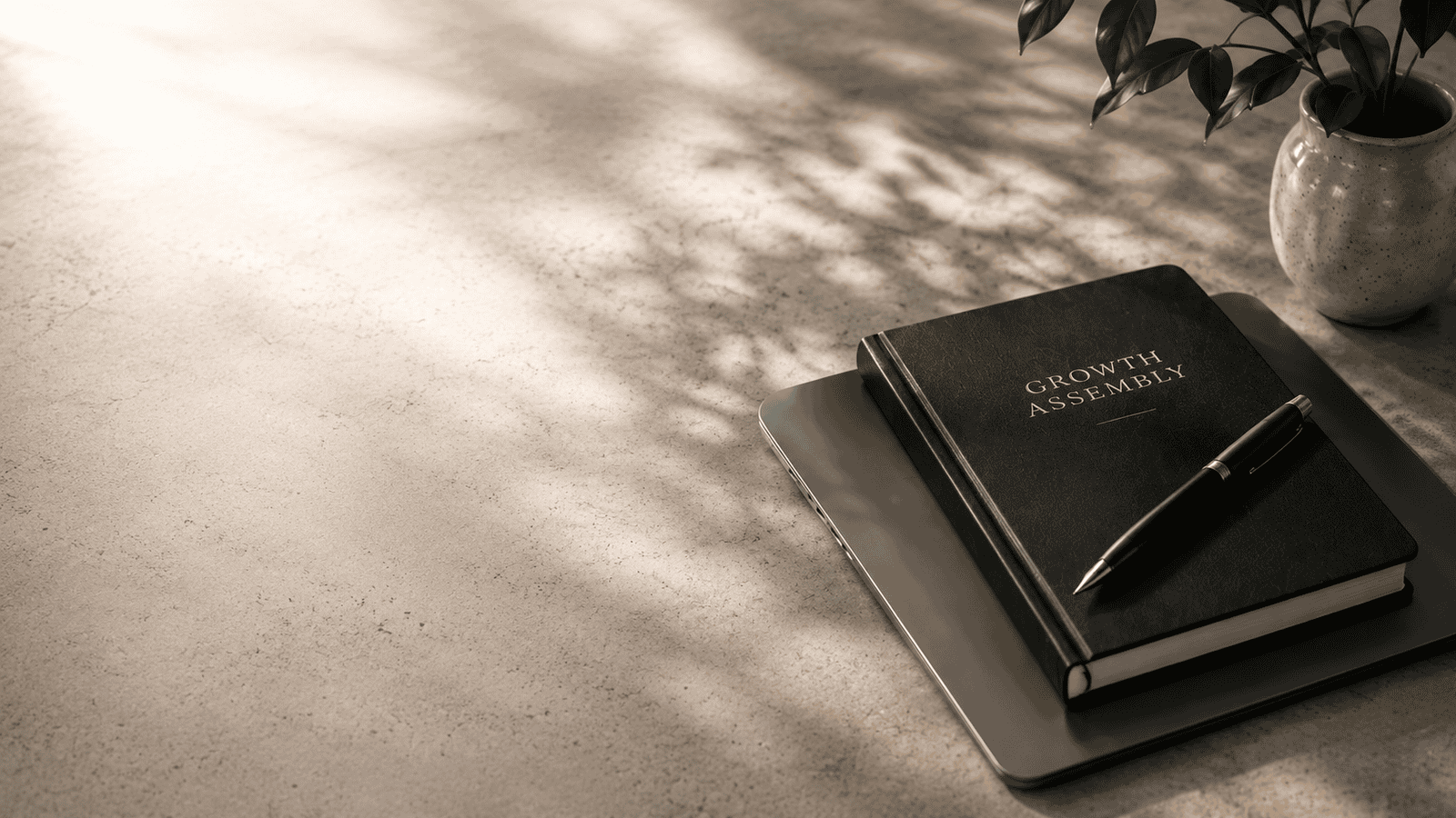 Growth Assembly notebook on desk